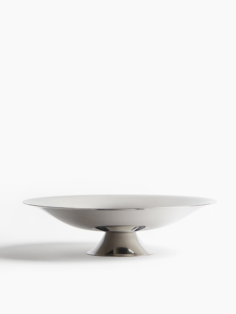 Silver metal bowl with a metallic base on a white background