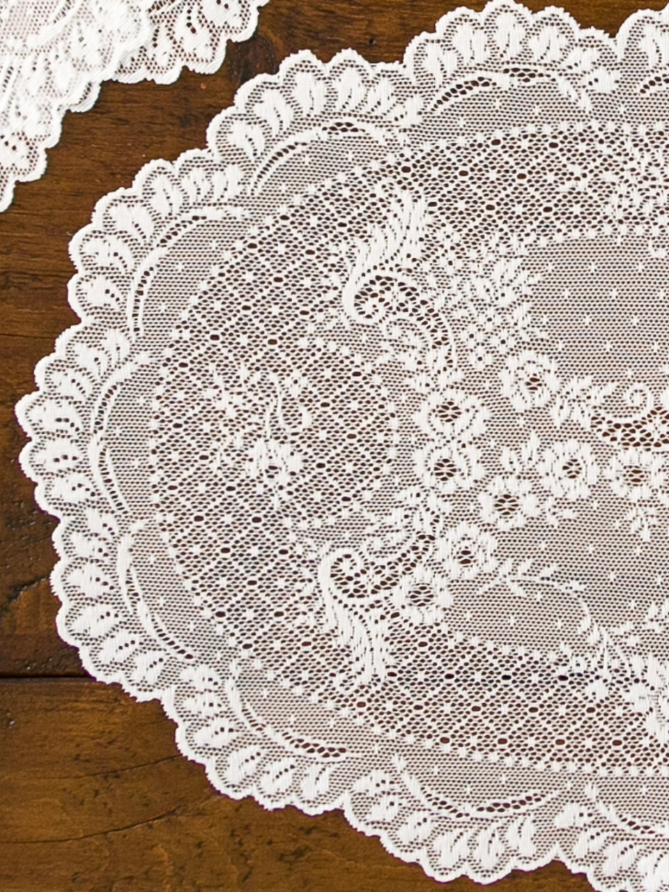 Close-up of a lace doily on a wooden surface